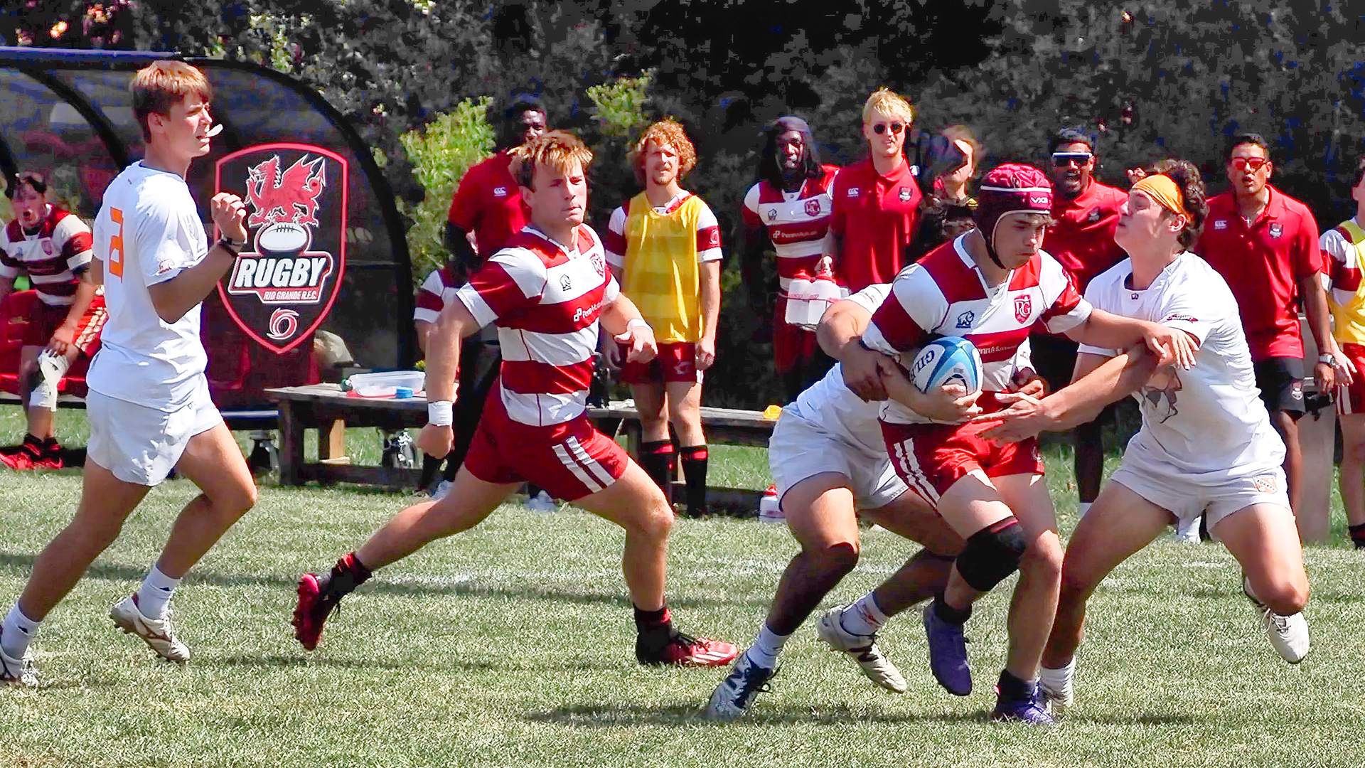 Rio Grande sophomore Josh Howgate tries to pull away from a pair of would-be University of Tennessee tacklers during Saturday afternoon's 31-31 tie with the Volunteers at Red Valley Pitch.