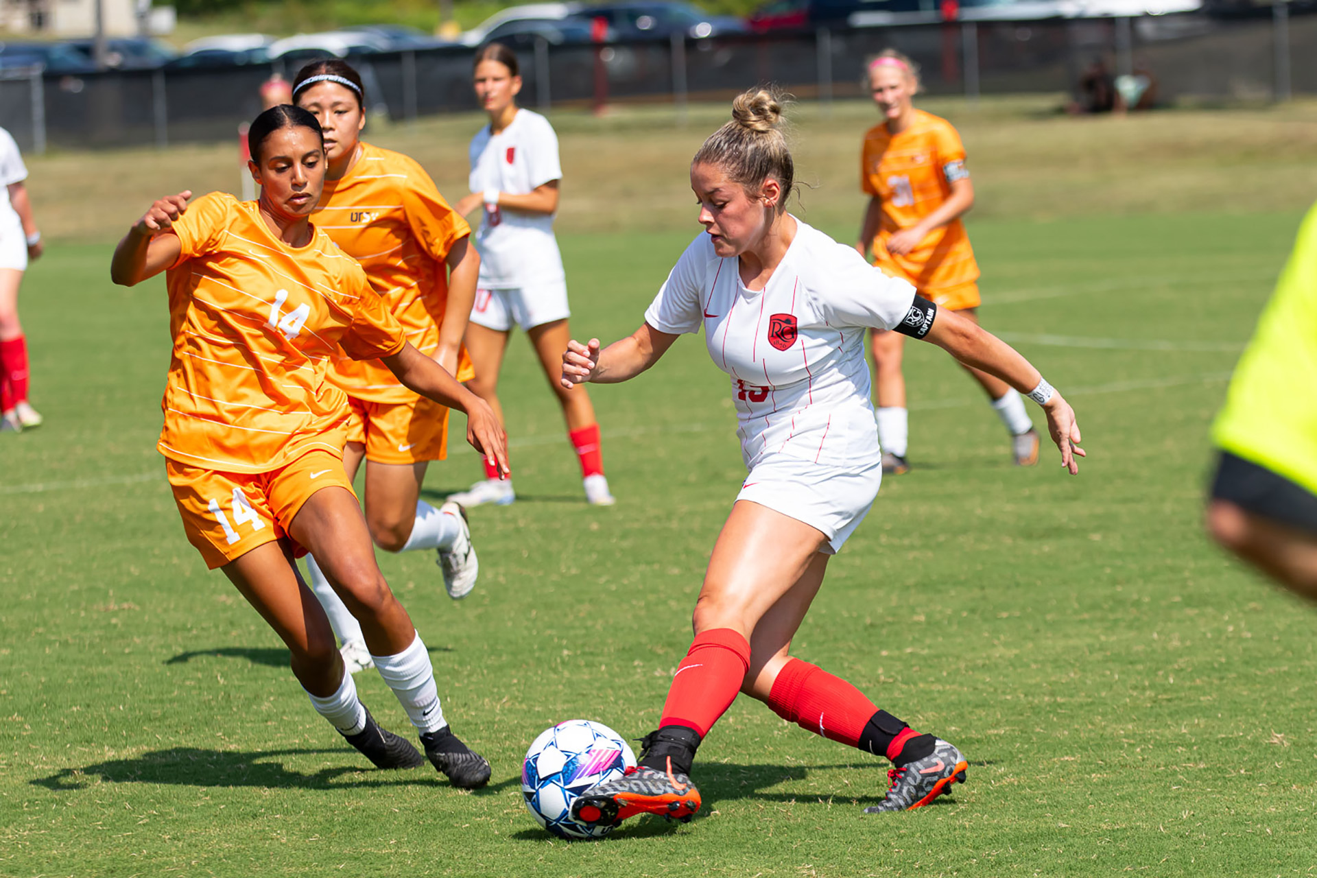 Rio Grande's Abi Seals attempts to make a pass, while Tennessee Southern's Kamilia Tayebi tries to intercept during the first half of Sunday morning's non-conference match at Evan E. Davis Field. The Firehawks won, 8-0.