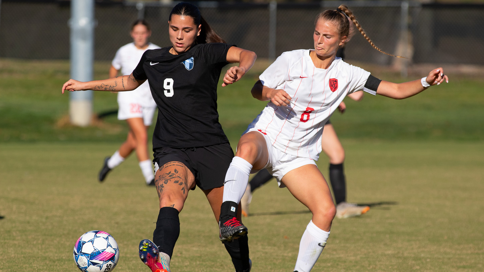 Rio Grande's Hannah Halstead battles Oakland City's Lobna Bouchkir for control of the ball during Saturday's match at Evan E. Davis Field.